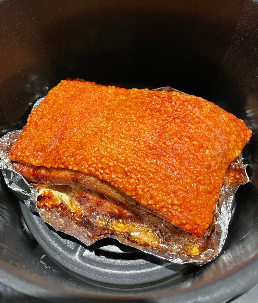 Whole piece of pork belly after it comes out of the air fryer